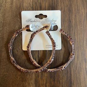 2 piece set of 2 inch crystal hoop earrings ( 1 red and 1 brown)